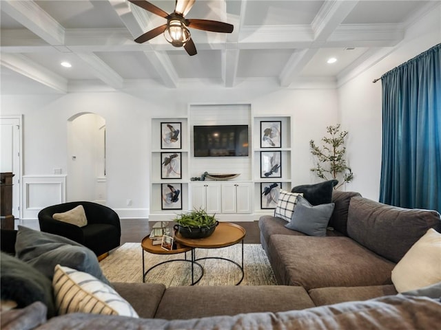 living room with beam ceiling, ceiling fan, coffered ceiling, and wood-type flooring