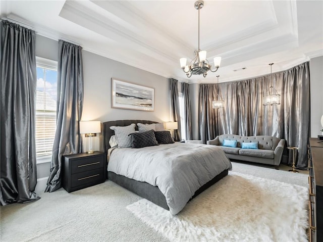 carpeted bedroom featuring a raised ceiling, a notable chandelier, and crown molding