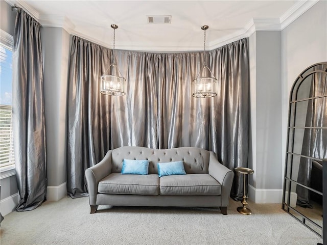 sitting room with plenty of natural light, an inviting chandelier, crown molding, and carpet