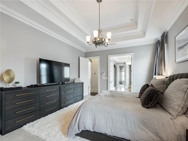 carpeted bedroom featuring a notable chandelier, crown molding, and a raised ceiling