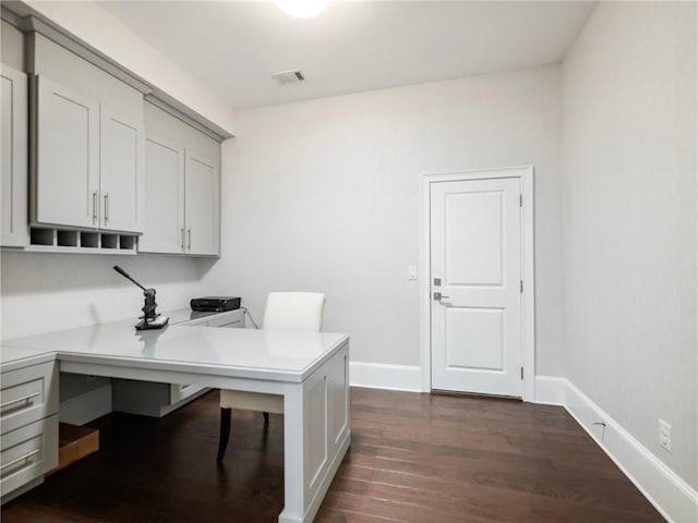 office space with dark wood-type flooring