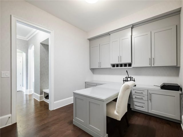 office space featuring dark hardwood / wood-style flooring and ornamental molding