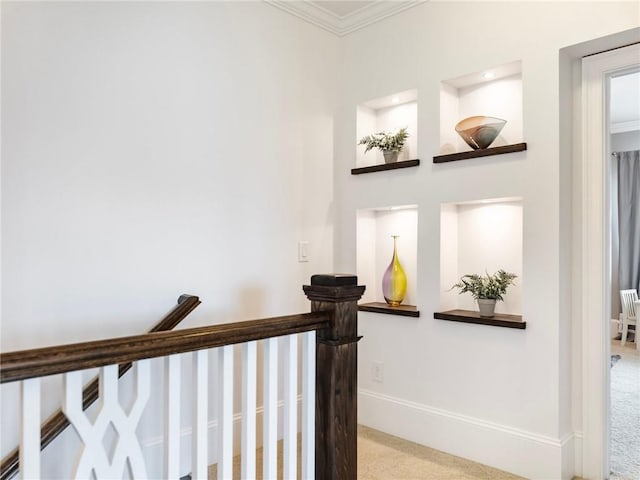 stairway with carpet floors and crown molding