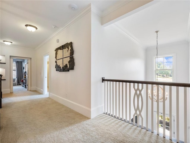 hallway featuring ornamental molding, light colored carpet, and beamed ceiling