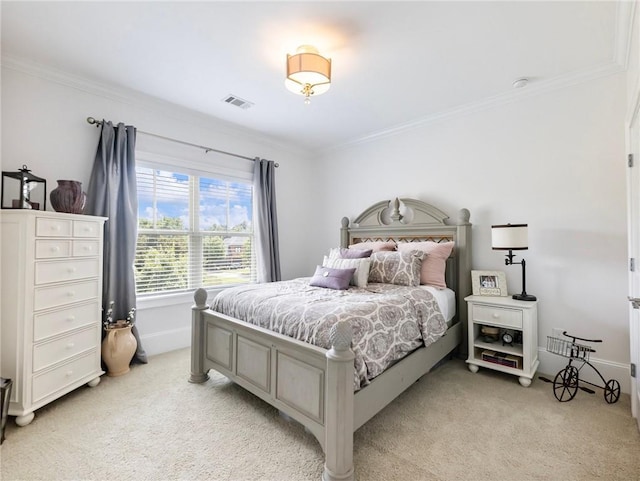 bedroom with ornamental molding and light colored carpet