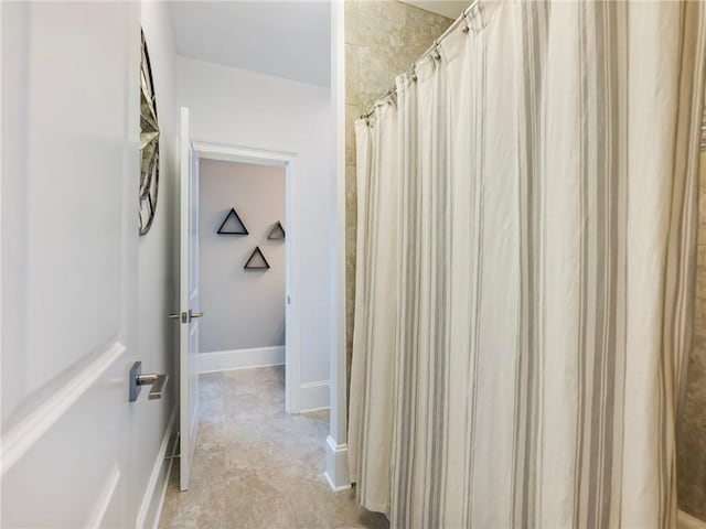 bathroom with curtained shower