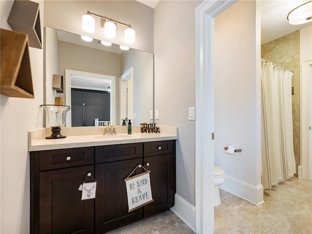 bathroom with toilet and vanity