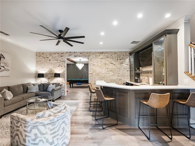 bar featuring pool table, ceiling fan, ornamental molding, and brick wall