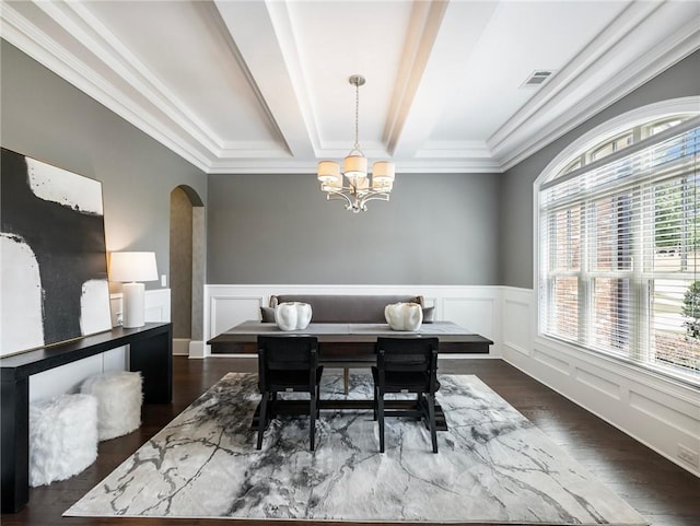 dining room featuring an inviting chandelier, crown molding, beamed ceiling, and dark hardwood / wood-style floors