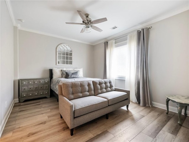 bedroom with ceiling fan, light hardwood / wood-style floors, and ornamental molding