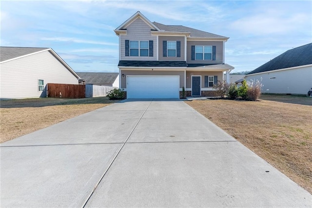 view of front of house with a front yard and a garage