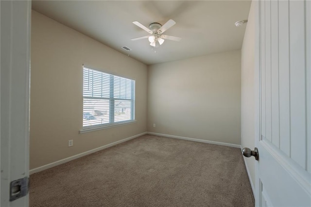 carpeted empty room with ceiling fan