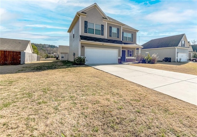 view of front of home featuring a front yard and a garage