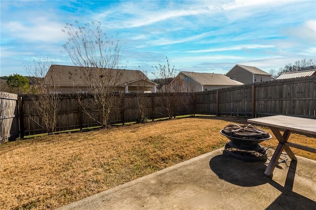 view of yard featuring a fire pit and a patio area