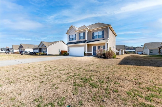 view of front of home with a garage and a front lawn