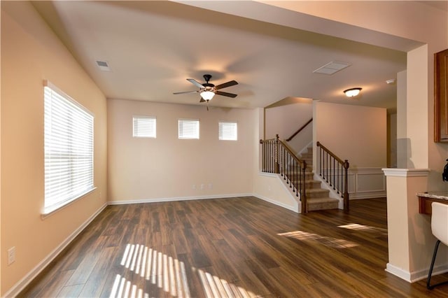 empty room featuring ceiling fan and dark wood-type flooring