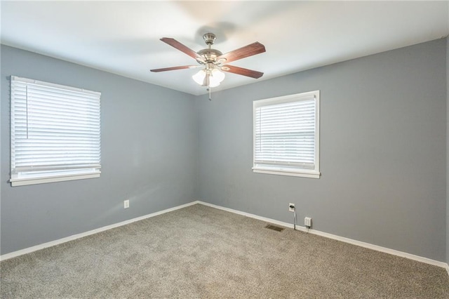 carpeted empty room with ceiling fan