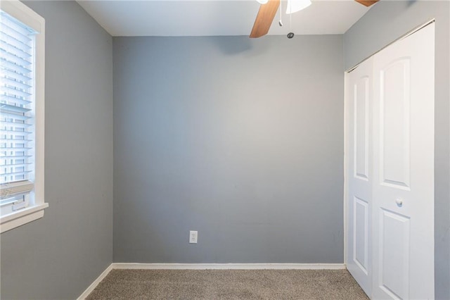 carpeted empty room with ceiling fan