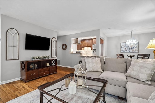 3408 Lake Pointe Cir, Roswell, GA 30075 - living room with wood finished floors and a chandelier