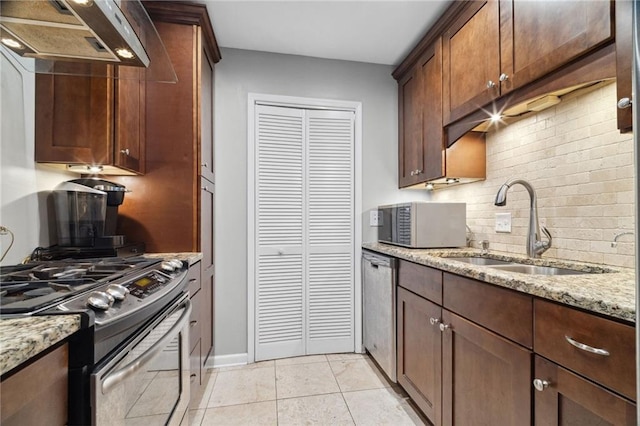 3408 Lake Pointe Cir, Roswell, GA 30075 - kitchen with appliances with stainless steel finishes, under cabinet range hood, tasteful backsplash, and light stone counters