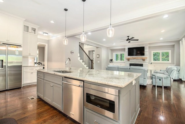 2638 Clairmont Rd, Atlanta, GA 30329 - kitchen featuring stainless steel appliances, a ceiling fan, healthy amount of natural light, crown molding, and dark wood-style floors
