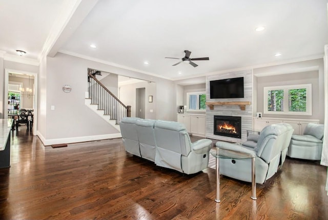 2638 Clairmont Rd, Atlanta, GA 30329 - living area with ornamental molding, dark wood-style flooring, a tiled fireplace, a ceiling fan, and stairway
