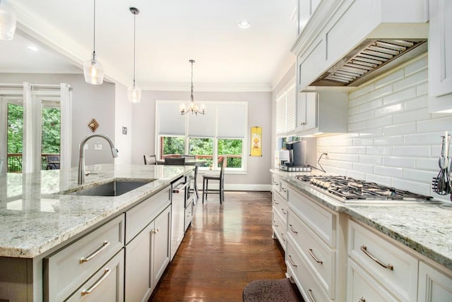 2638 Clairmont Rd, Atlanta, GA 30329 - kitchen with stainless steel appliances, premium range hood, backsplash, ornamental molding, and a chandelier