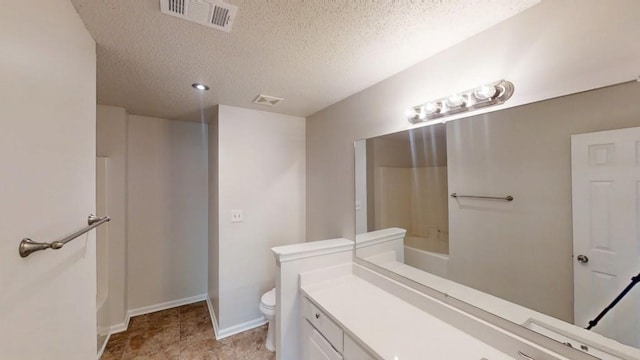 bathroom with toilet, a textured ceiling, a tub to relax in, vanity, and a shower