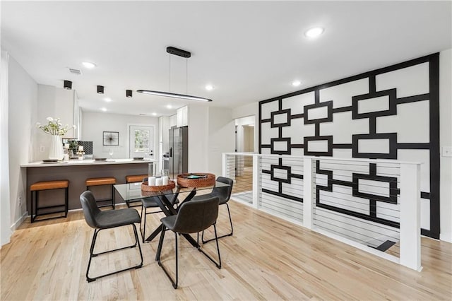 dining room with light hardwood / wood-style floors