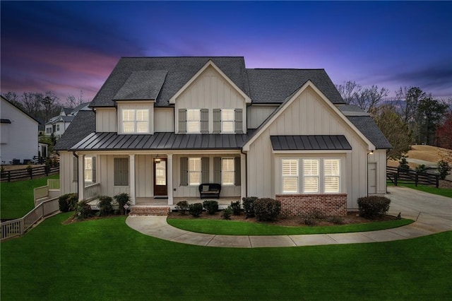 modern inspired farmhouse featuring a standing seam roof, a porch, and board and batten siding