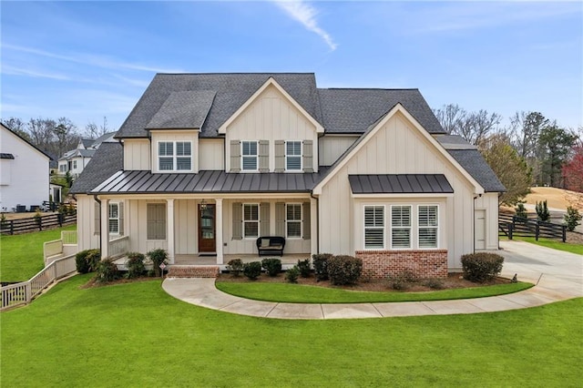 201 Ivy Meadow Way, Ball Ground, GA 30107 - modern inspired farmhouse with a standing seam roof, board and batten siding, and covered porch