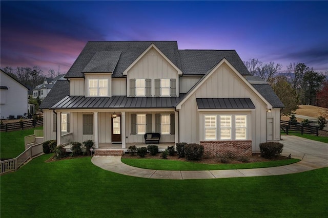 201 Ivy Meadow Way, Ball Ground, GA 30107 - modern farmhouse style home with a standing seam roof, board and batten siding, and a porch
