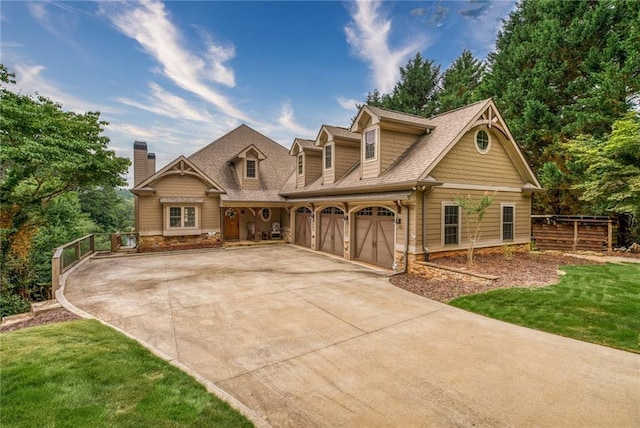 view of front of property with a front lawn and a garage