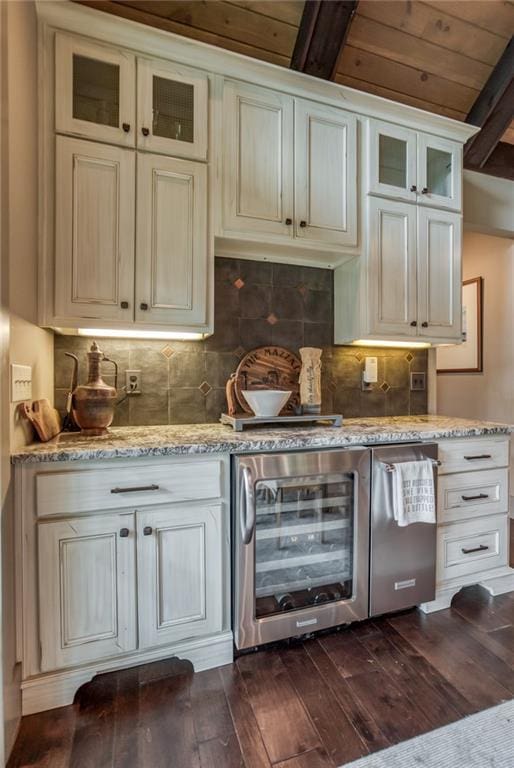 kitchen featuring wooden ceiling, dark hardwood / wood-style floors, beverage cooler, and light stone countertops