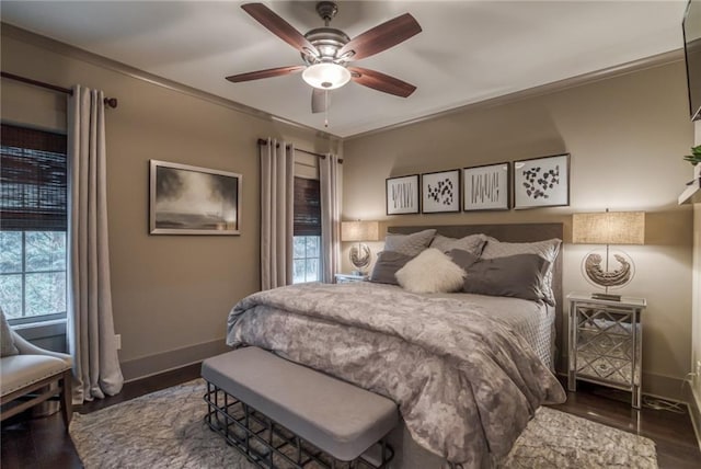 bedroom featuring dark hardwood / wood-style flooring and ceiling fan