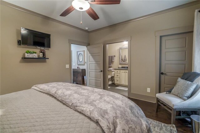 bedroom featuring ceiling fan, connected bathroom, and hardwood / wood-style floors