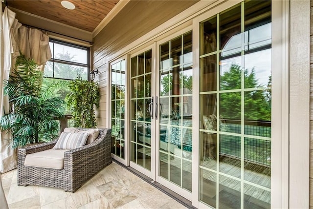 unfurnished sunroom featuring wood ceiling