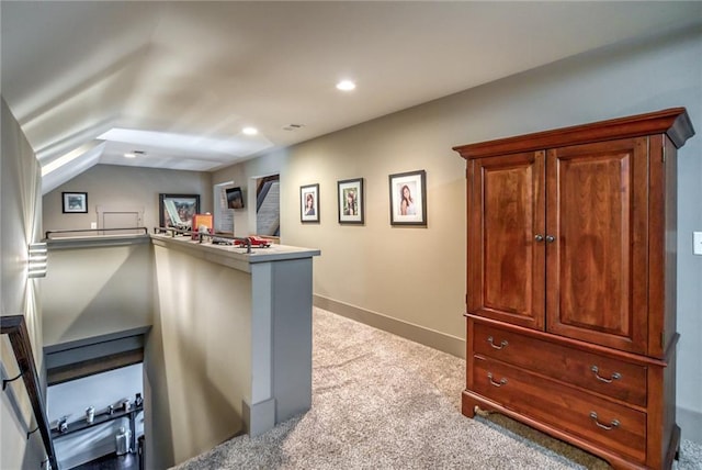 bar with light carpet and lofted ceiling