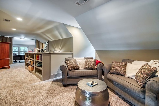 carpeted living room featuring vaulted ceiling