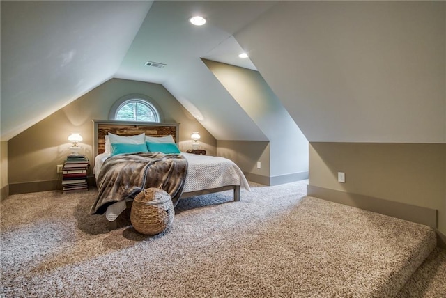 bedroom with carpet flooring and vaulted ceiling