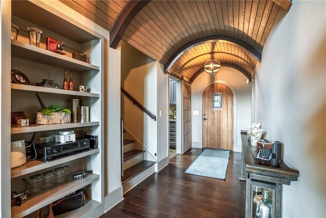 entrance foyer with vaulted ceiling, wooden ceiling, and dark hardwood / wood-style floors