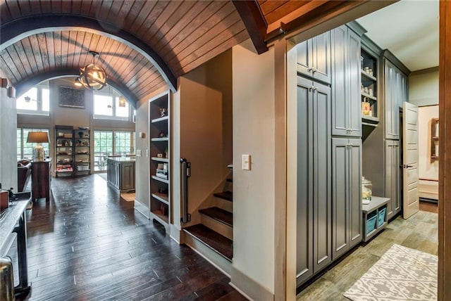 hall with lofted ceiling, wood ceiling, and hardwood / wood-style flooring