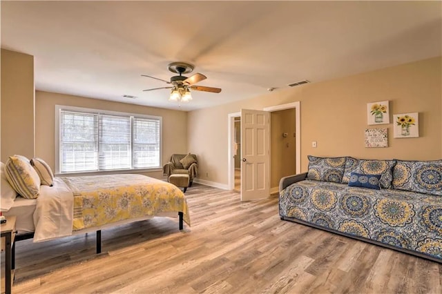 bedroom featuring ceiling fan and light hardwood / wood-style floors