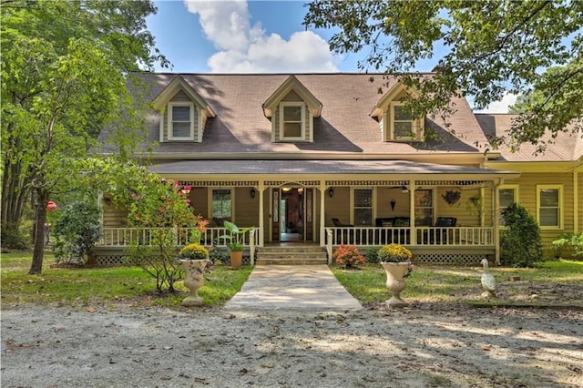 new england style home with covered porch