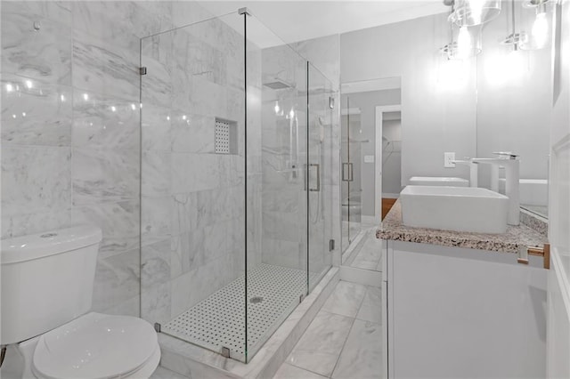 bathroom featuring vanity, toilet, walk in shower, and tile walls