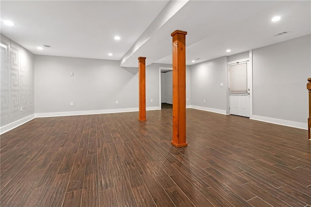 basement with dark hardwood / wood-style floors