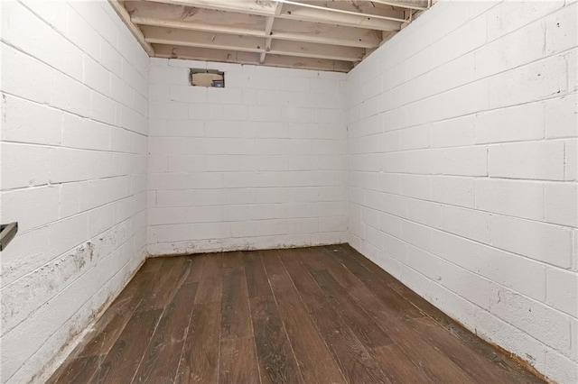 basement with dark wood-type flooring