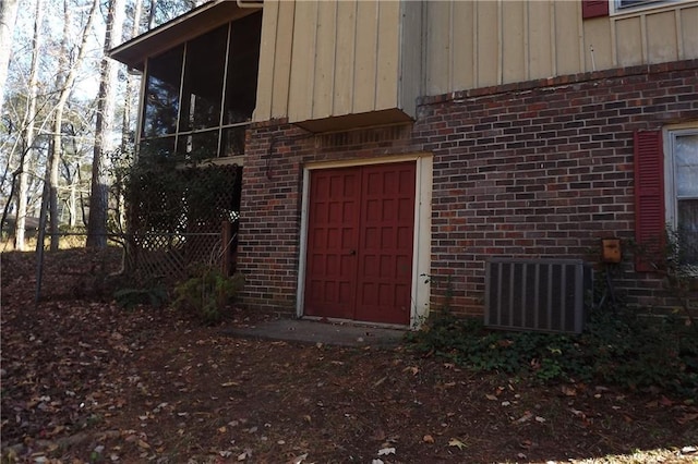 doorway to property featuring central AC