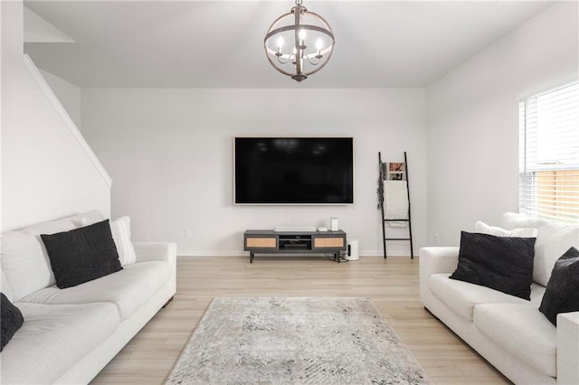 187 Lyndhurst Dr, Bethlehem, GA 30620 - living area with a chandelier, light wood-style flooring, and baseboards