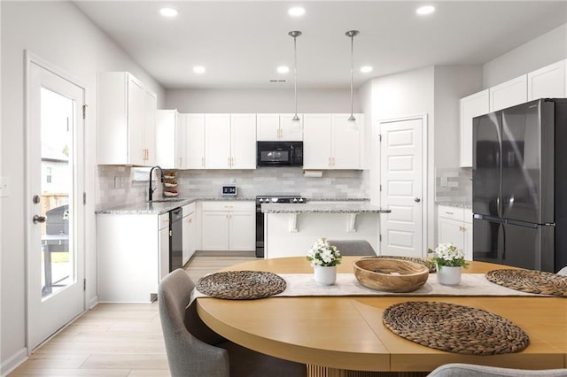 187 Lyndhurst Dr, Bethlehem, GA 30620 - kitchen featuring appliances with stainless steel finishes, a sink, tasteful backsplash, white cabinetry, and recessed lighting
